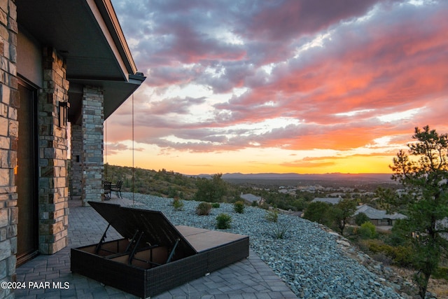 view of patio terrace at dusk