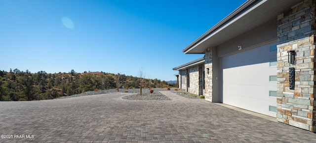 5535 W Corliss Cir, Prescott, AZ 86305 - view of patio / terrace featuring decorative driveway and an attached garage