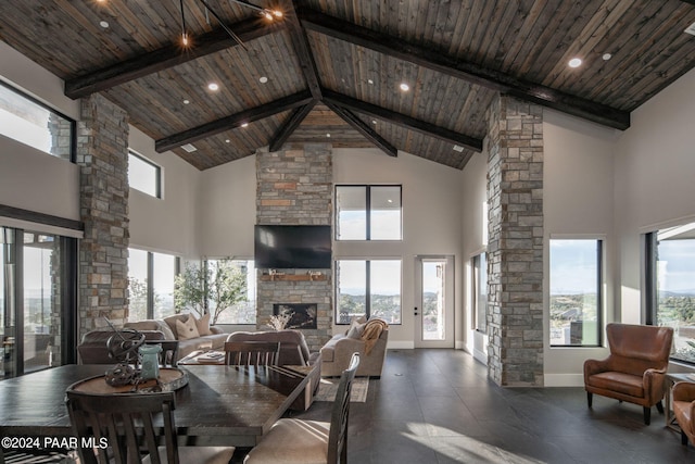5535 W Corliss Cir, Prescott, AZ 86305 - dining area featuring high vaulted ceiling, a fireplace, wooden ceiling with exposed beams, baseboards, and recessed lighting