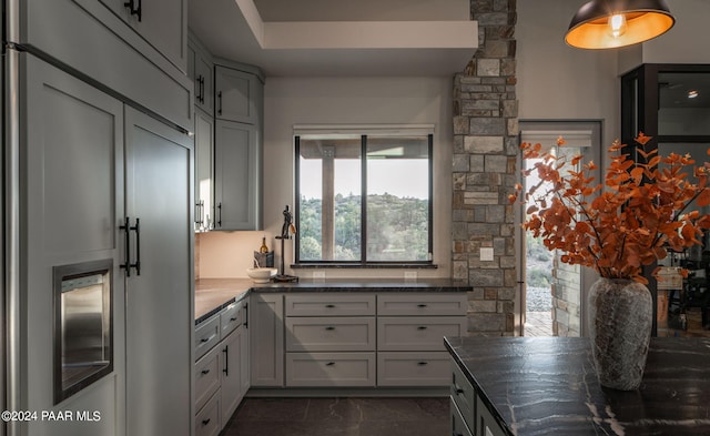 5535 W Corliss Cir, Prescott, AZ 86305 - kitchen featuring paneled fridge, healthy amount of natural light, dark marble finish flooring, and dark stone countertops