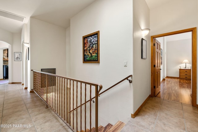 4710 Echo Canyon Pl, Prescott, AZ 86301 - hall with baseboards, arched walkways, an upstairs landing, and light tile patterned flooring