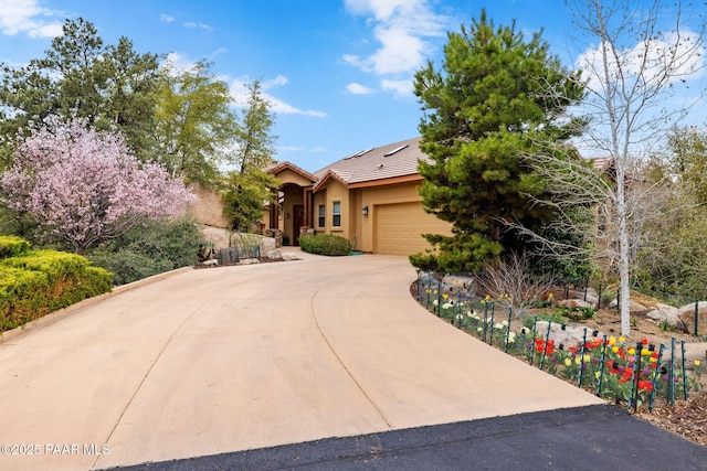 4710 Echo Canyon Pl, Prescott, AZ 86301 - view of front of house with a garage, a tiled roof, solar panels, stucco siding, and curved driveway