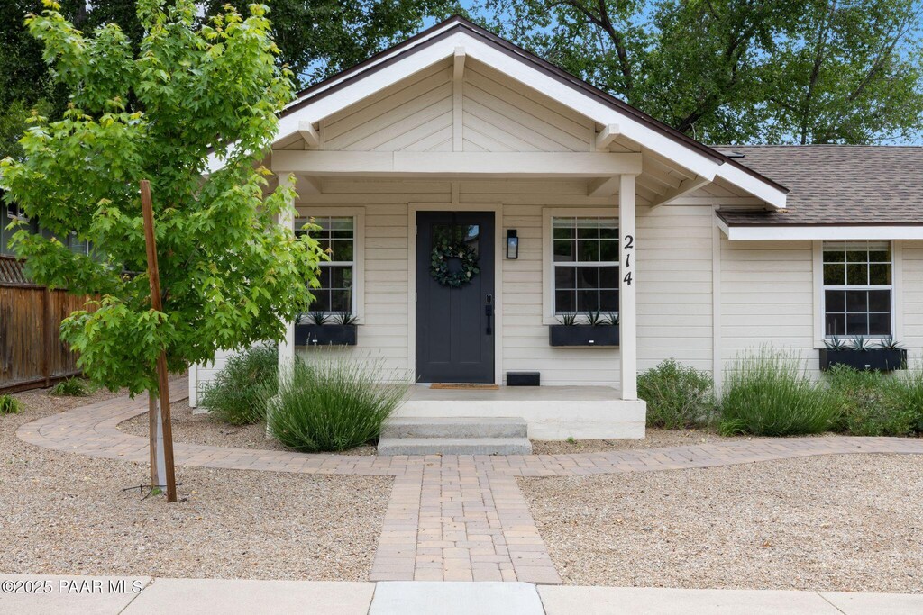 214 N Washington Ave, Prescott, AZ 86301 - view of front of home featuring a shingled roof and a porch