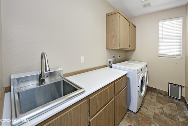 6582 E Farmstead Rd, Prescott Valley, AZ 86314 - laundry area featuring cabinet space, stone tile floors, and washer and clothes dryer