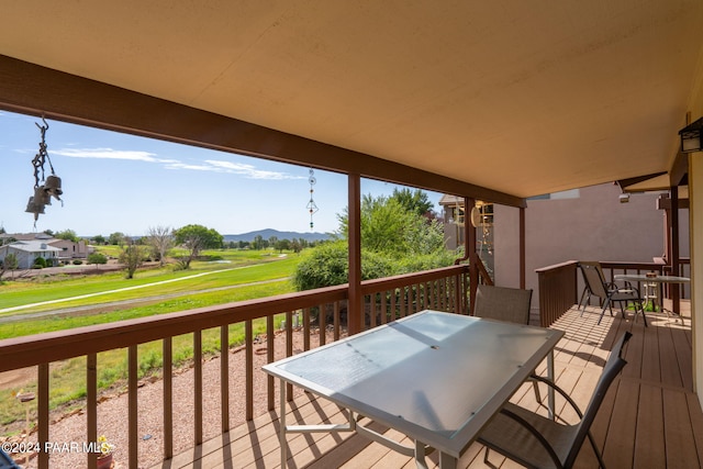 wooden terrace with a mountain view