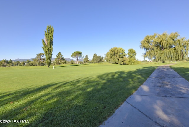 view of home's community featuring a lawn