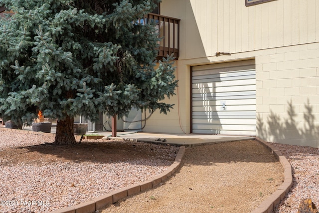 view of side of home with a garage