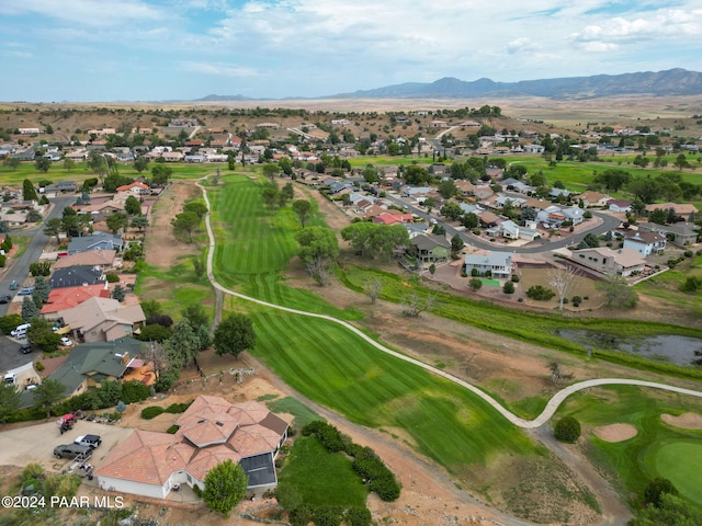 birds eye view of property with a mountain view