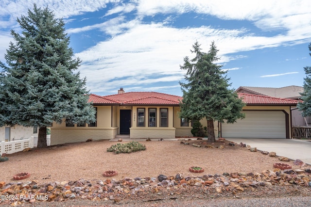 ranch-style home with a garage