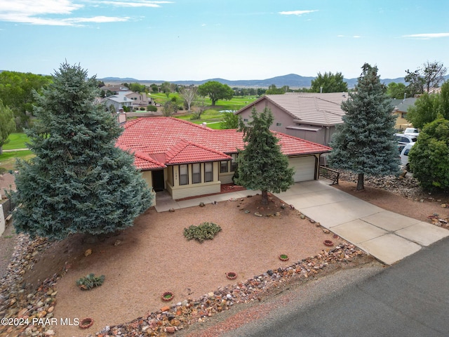 view of front of house with a mountain view and a garage