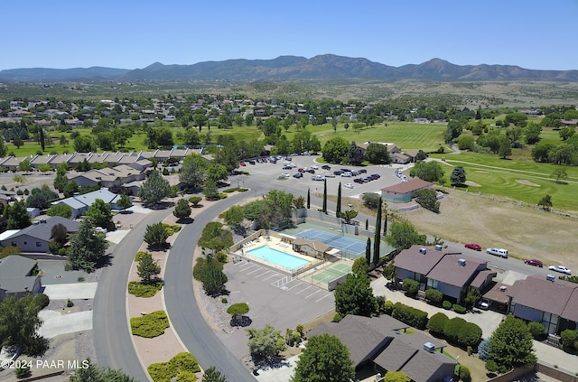 birds eye view of property with a mountain view