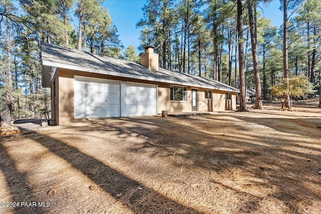 view of home's exterior with a garage