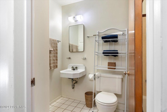 bathroom featuring tile patterned flooring and toilet