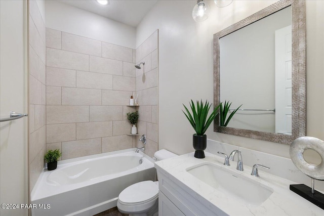 full bathroom with vanity, toilet, and tiled shower / bath combo