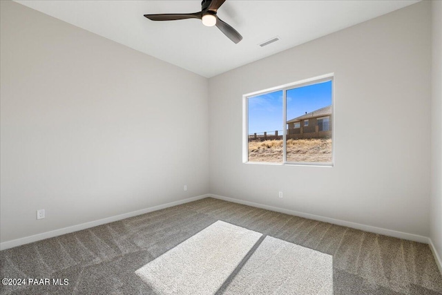 empty room featuring carpet and ceiling fan