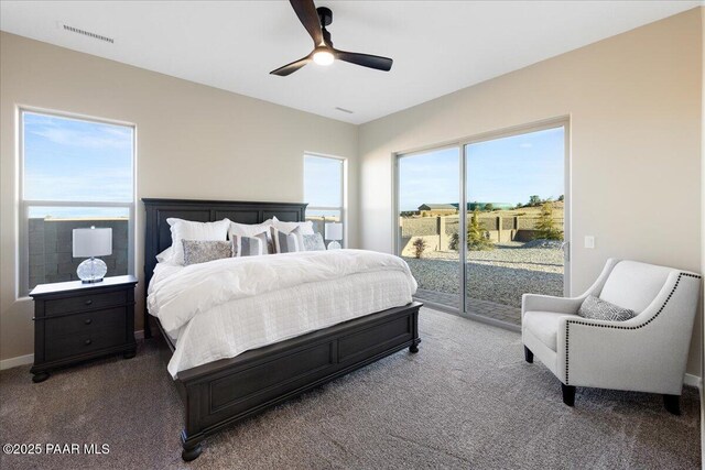 carpeted bedroom featuring access to exterior and ceiling fan