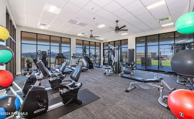 workout area featuring a paneled ceiling