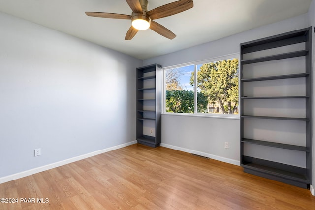 spare room featuring ceiling fan and light wood-type flooring