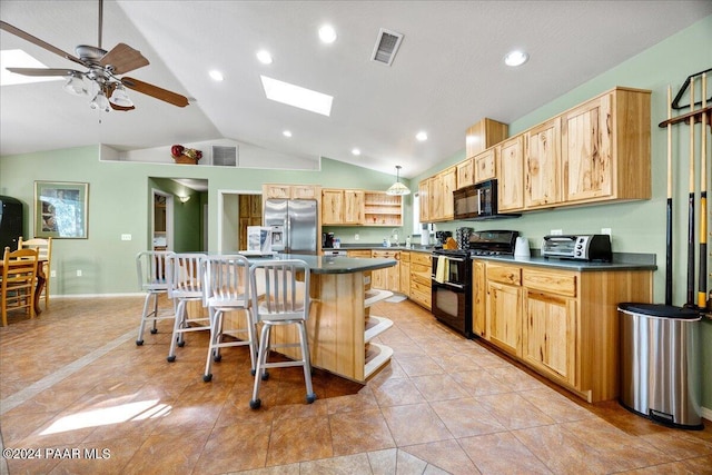 kitchen with dark countertops, visible vents, black appliances, and light brown cabinetry