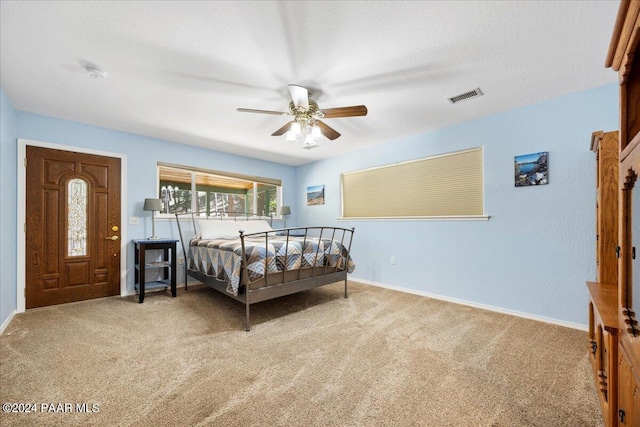 bedroom featuring visible vents, carpet flooring, baseboards, and ceiling fan