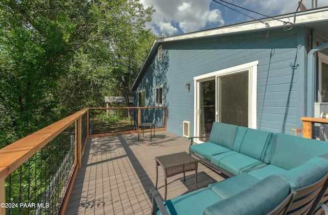 wooden deck featuring an outdoor hangout area