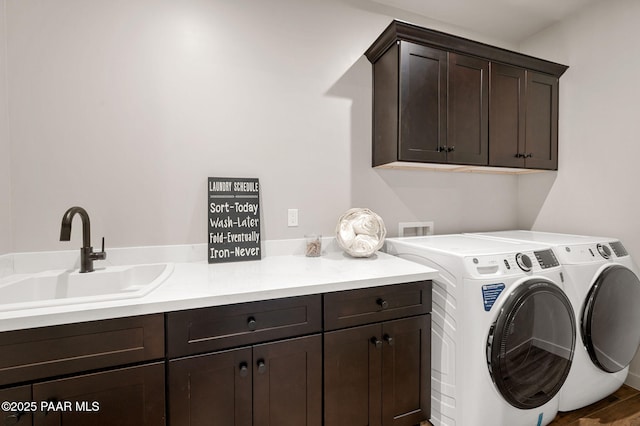 5711 E Hahn St, Prescott Valley, AZ 86314 - laundry room with cabinet space and washer and clothes dryer