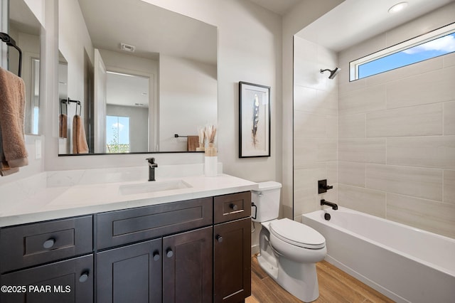 5711 E Hahn St, Prescott Valley, AZ 86314 - full bathroom featuring vanity, wood finished floors, and washtub / shower combination