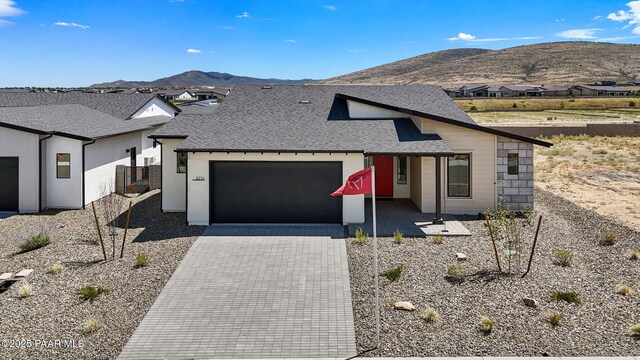 5711 E Hahn St, Prescott Valley, AZ 86314 - view of front of home featuring a mountain view, an attached garage, decorative driveway, and roof with shingles