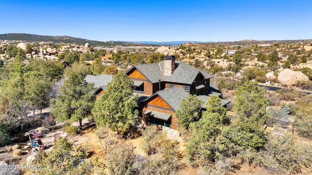 birds eye view of property with a mountain view