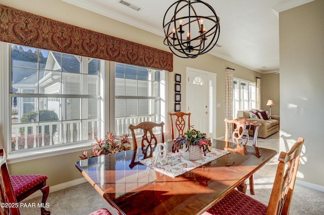 carpeted dining room featuring a notable chandelier and crown molding