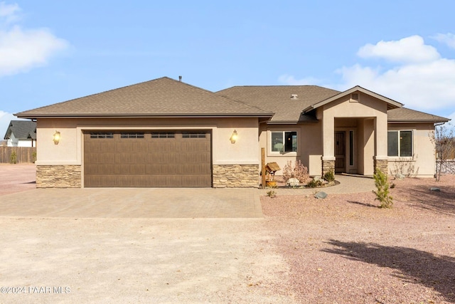 prairie-style house featuring a garage