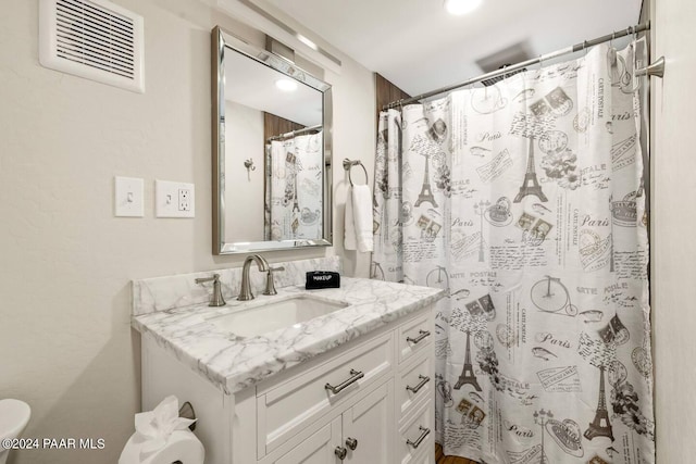 bathroom with vanity and walk in shower