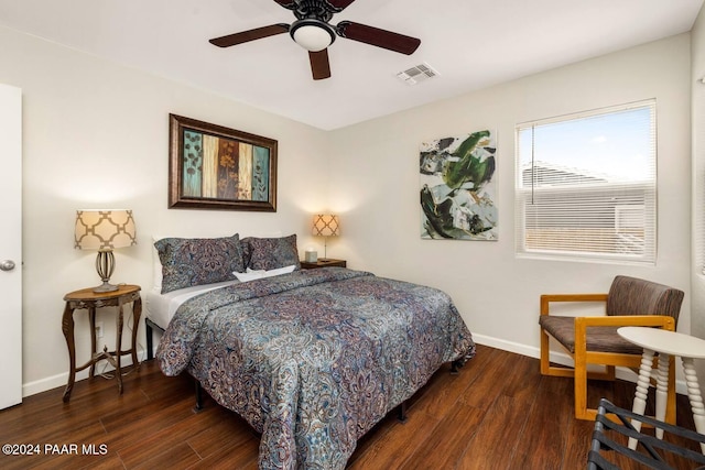 bedroom featuring dark hardwood / wood-style floors and ceiling fan