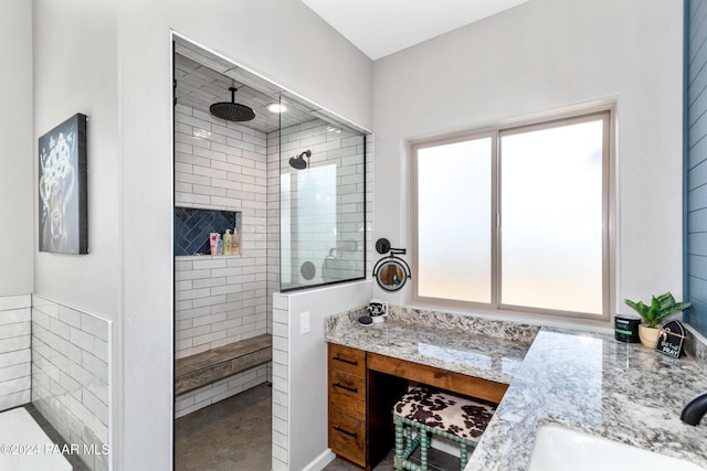 full bath with a walk in shower and vanity