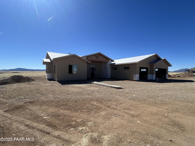 view of front of home with a mountain view