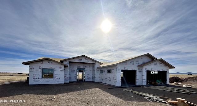 property in mid-construction featuring an outdoor structure