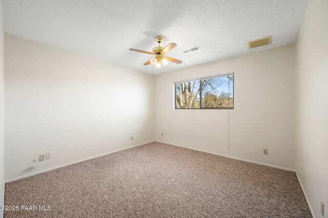 401 Valley Pl, Prescott, AZ 86301 - spare room featuring a textured ceiling, carpet flooring, ceiling fan, and visible vents