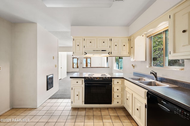 401 Valley Pl, Prescott, AZ 86301 - kitchen with cream cabinetry, under cabinet range hood, a sink, a wealth of natural light, and black appliances