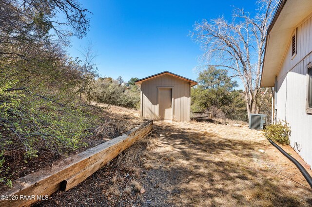 401 Valley Pl, Prescott, AZ 86301 - view of yard featuring an outdoor structure, central AC, and a storage shed
