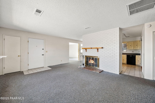 401 Valley Pl, Prescott, AZ 86301 - unfurnished living room featuring light carpet, a textured ceiling, a fireplace, and visible vents