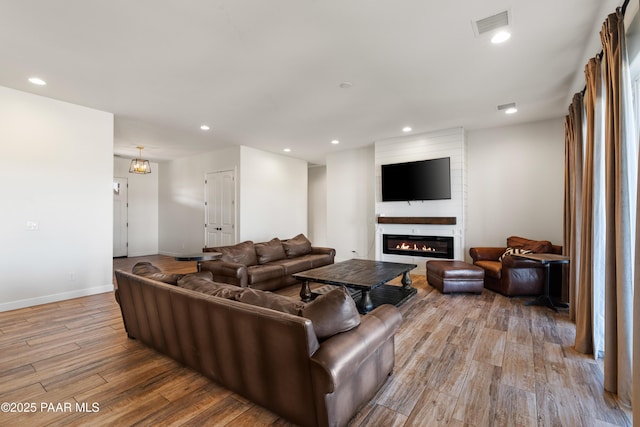 9550 N Manger Rd, Prescott Valley, AZ 86314 - living room featuring light wood finished floors, recessed lighting, and a fireplace