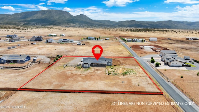 9550 N Manger Rd, Prescott Valley, AZ 86314 - aerial view of sparsely populated area featuring property boundaries highlighted and a mountain backdrop