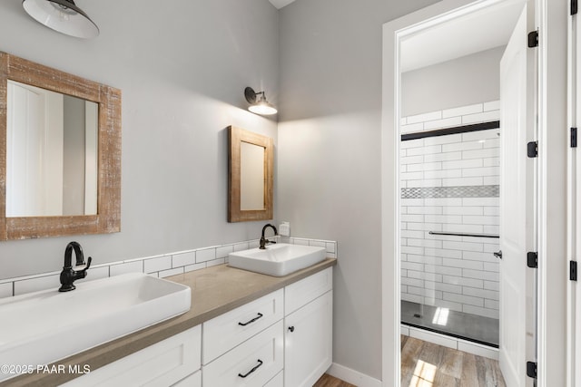 9550 N Manger Rd, Prescott Valley, AZ 86314 - bathroom featuring double vanity, a stall shower, and wood finished floors