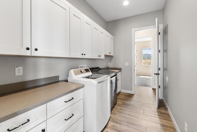 9550 N Manger Rd, Prescott Valley, AZ 86314 - laundry room with cabinet space, washing machine and dryer, light wood-style flooring, and recessed lighting