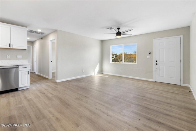 unfurnished living room featuring ceiling fan and light hardwood / wood-style flooring