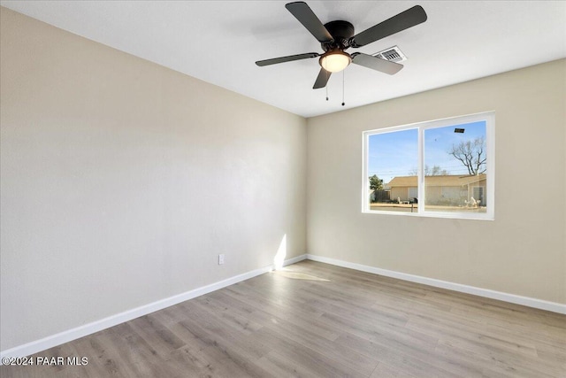 spare room with ceiling fan and light hardwood / wood-style flooring