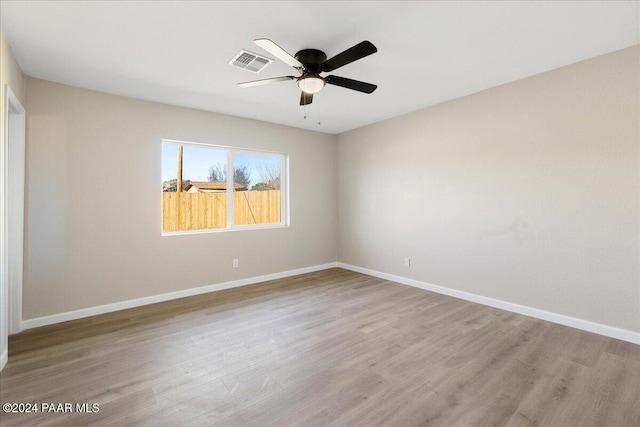 spare room featuring ceiling fan and light hardwood / wood-style floors