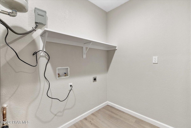 clothes washing area featuring hookup for a washing machine, wood-type flooring, and hookup for an electric dryer