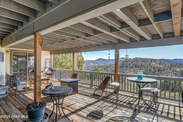 wooden terrace with a mountain view