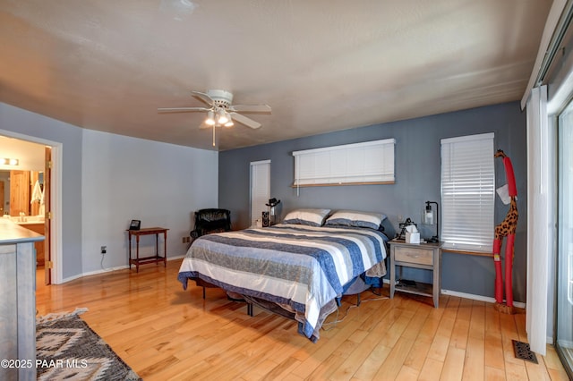 bedroom with ceiling fan and light hardwood / wood-style flooring